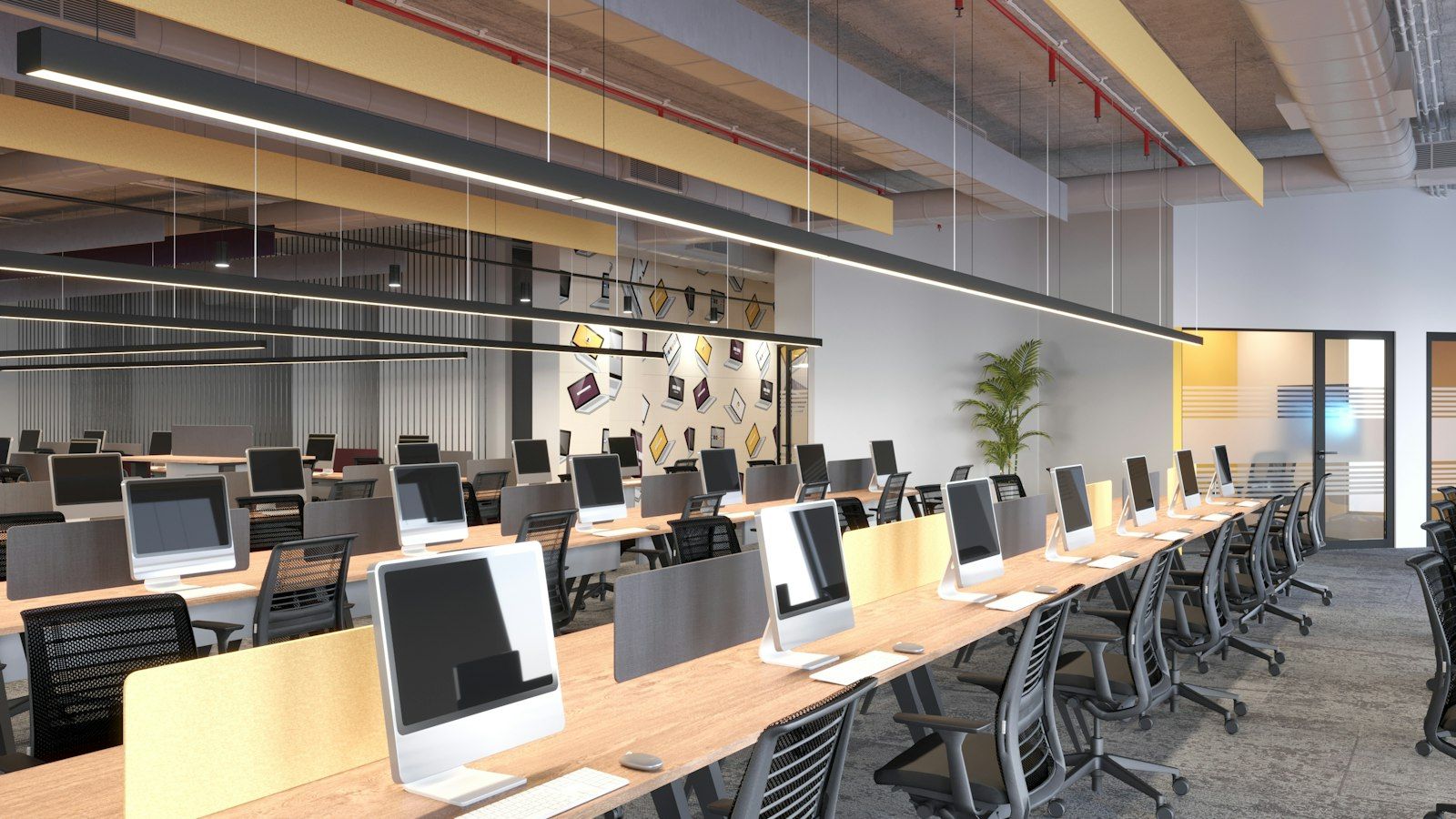 An open-plan tech workspace with rows of desks and monitors